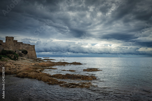Dramatic seascape with an old fortress