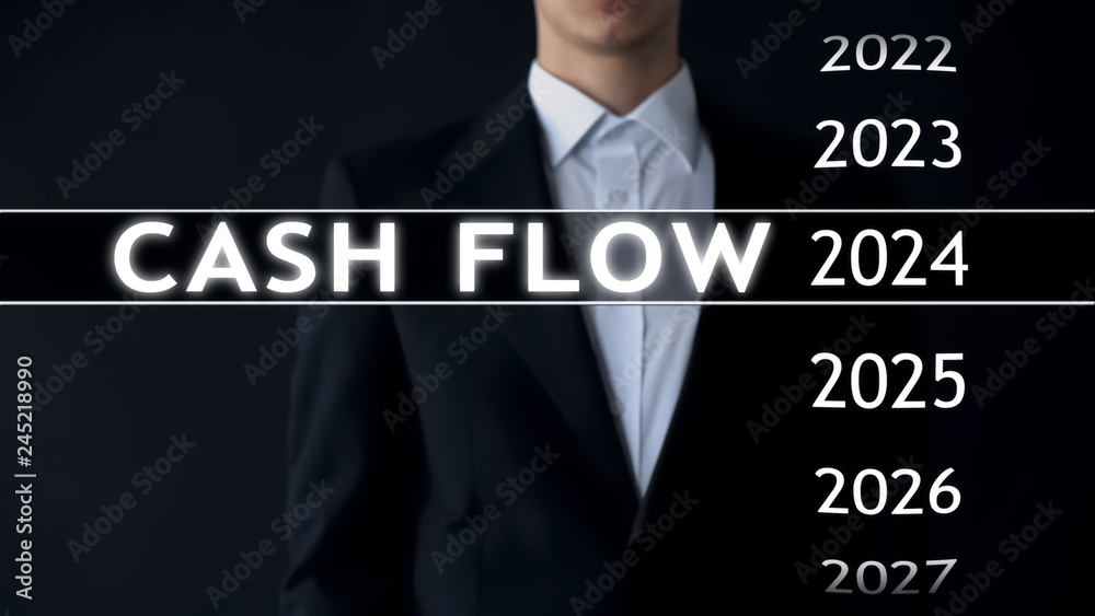 Cash flow for 2024, businessman selects financial report on virtual screen Cash flow for 2024, businessman selects financial report on virtual screen