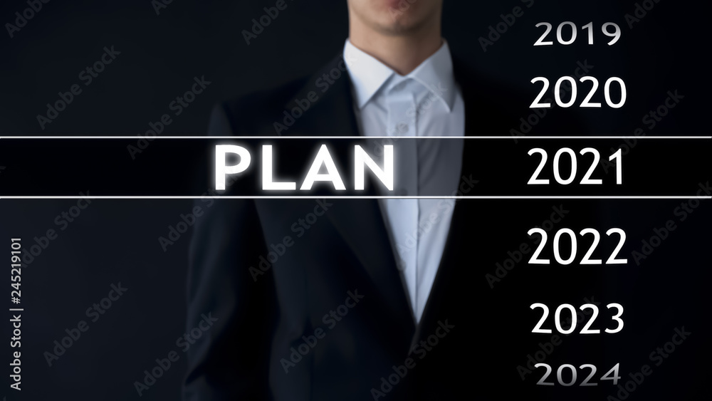 Plan for 2021, businessman chooses file on virtual screen, startup strategy Plan for 2021, businessman chooses file on virtual screen, startup strategy