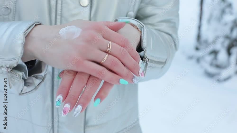 Woman applying winter protective cream. Woman applying winter protective cream.