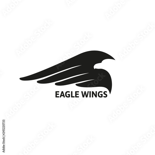 Eagle Looks Into the Distance Against the Backdrop of its Wing. Vector Logo with Negative Space.
