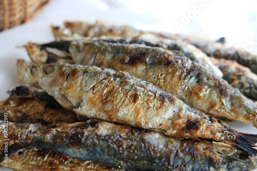 Plate of charcoal-grilled sardines typical of coastal towns