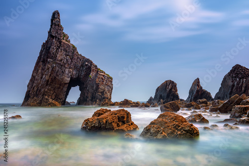 View of Campiecho beach against cloudy sky photo