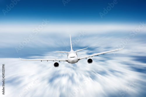 Modern airplane mith motion blur effect travel at sunny bright day