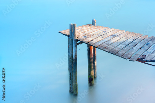 View of wooden jetty in lake photo