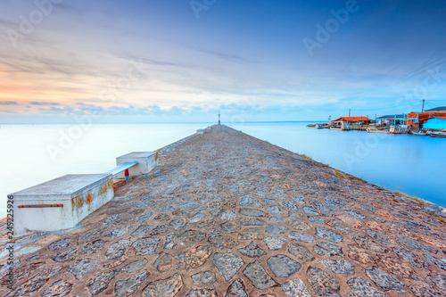 View of pier against cloudy sky photo