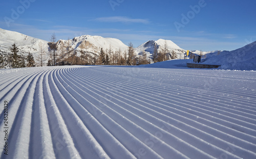 Brunnach Ski Resort, St. Oswald, Carinthia, Austria - January 20, 2019: View over the slope to the Nockberge, Carinthia, Austria beyond.