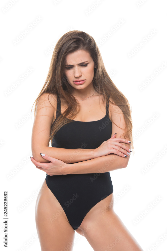 Young woman is suffering from stomach ache isolated on white background. Gynecology period, female healthcare, digestive system, Urinary Tract Infections, bowel pain Young woman is suffering from stomach ache isolated on white background. Gynecology period, female healthcare, digestive system, Urinary Tract Infections, bowel pain