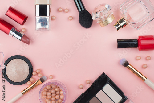 Fashion collection with accessories, flowers, cosmetics and jewelry on pink background, copyspace. Womens Day concept