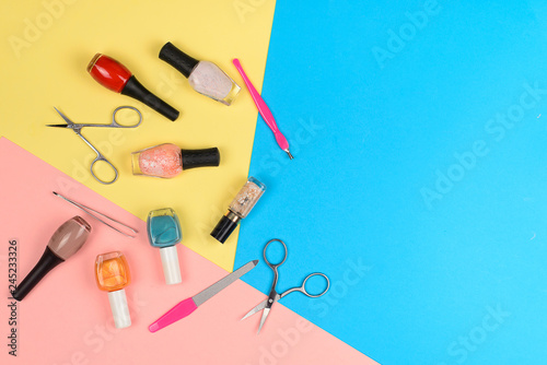  Nail polishes and accessories on a colorful background