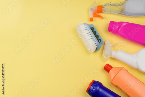 Cleaning products on a yellow background with a copyspace