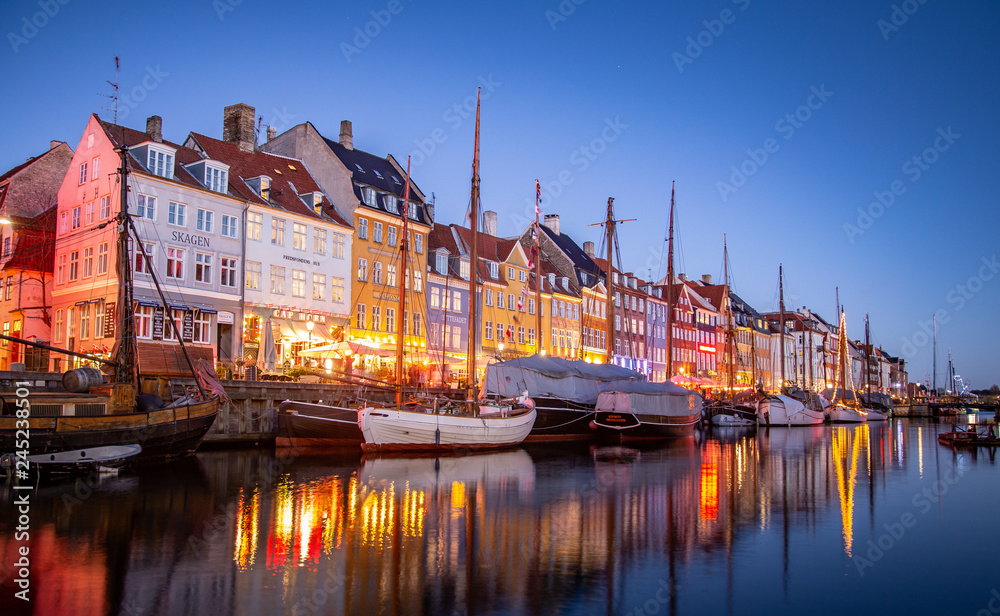 Denmark Copenhagen Nyhavn boats in a canal colorful houses