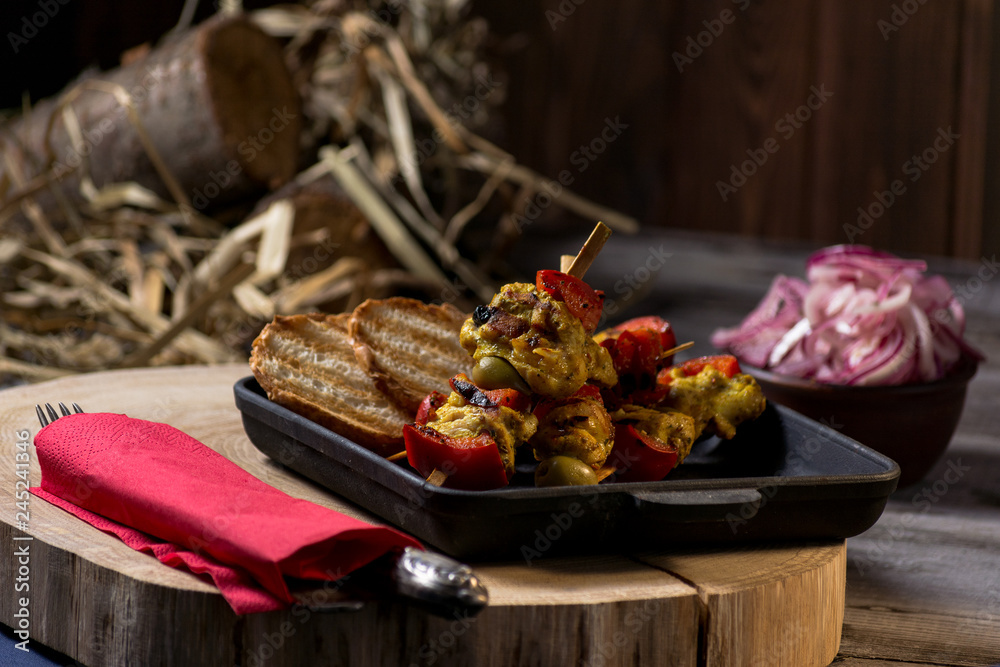 Traditional dinner in a country house. Meat with vegetables and bread. Hearty and tasty dish.Menu background for cafe and restaurant. Place for text.