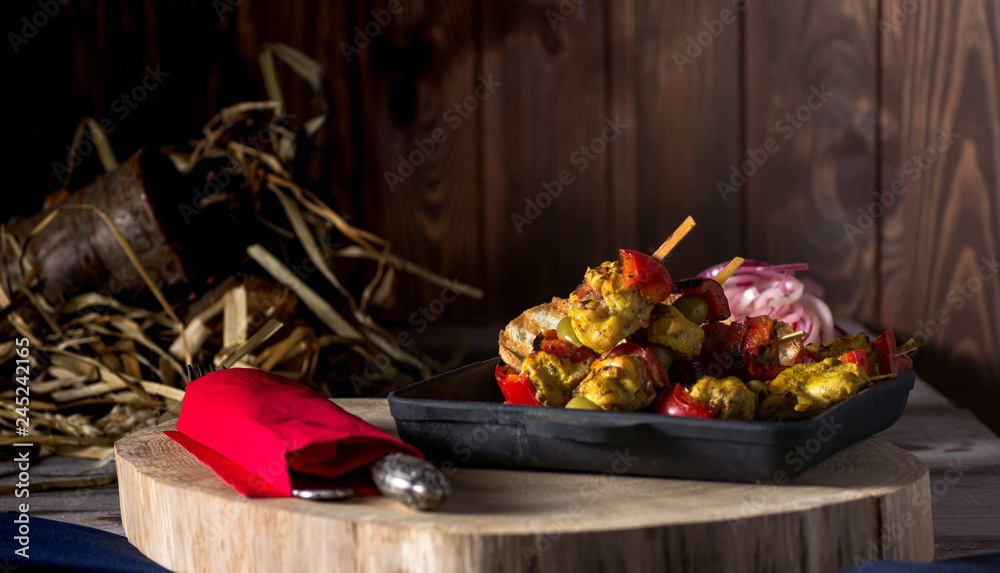 Traditional dinner in a country house. Meat with vegetables and bread. Hearty and tasty dish.Menu background for cafe and restaurant. Place for text.