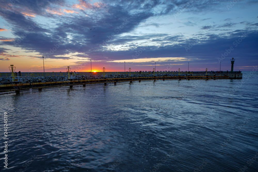 Epic sunset at seaside with dramatic sky