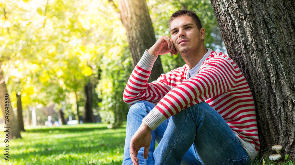 Young man resting in the public park Young man resting in the public park