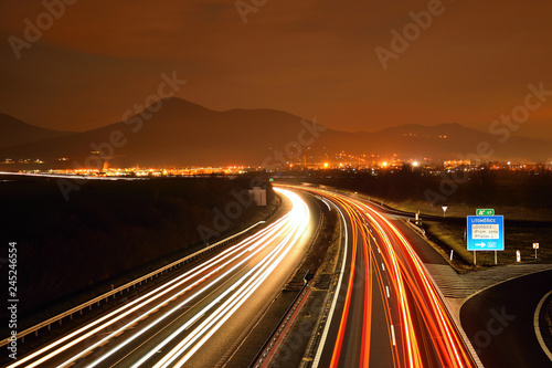 Highway D8 and Lovos hill on horizont in night on 16th january in czech republic