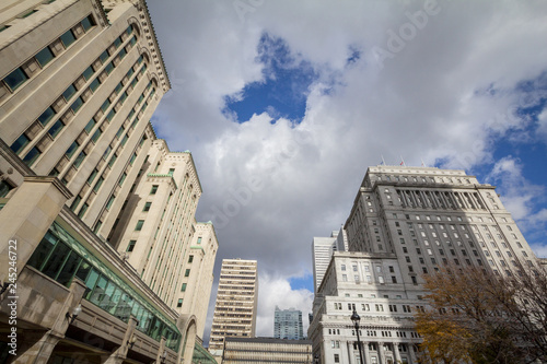 Panorama of old stone skyscrapers and high rise office towers in Montreal dowtown, on Place Victoria Square. Montreal is the historic economic hub of Canada, and a financial center of america.