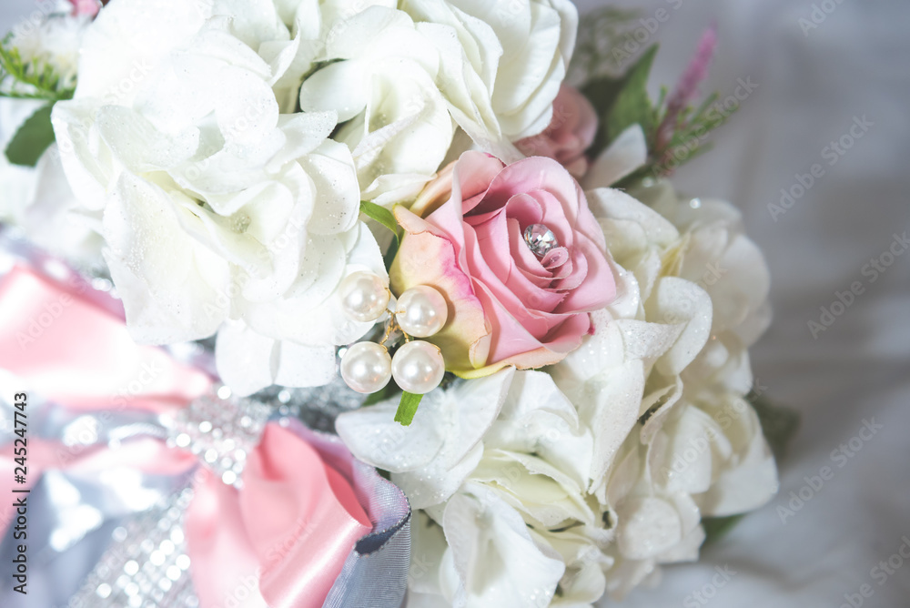 Obraz premium Bridal flowers bouquet with roses and ribbon