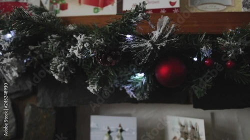 Christmas garland over fireplace during Christmas on a slider