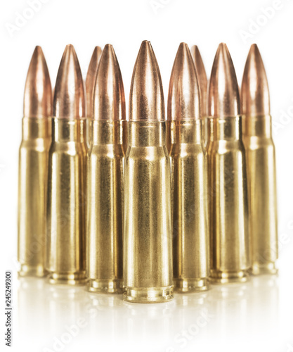 Golden rifle cartridges isolated on white background