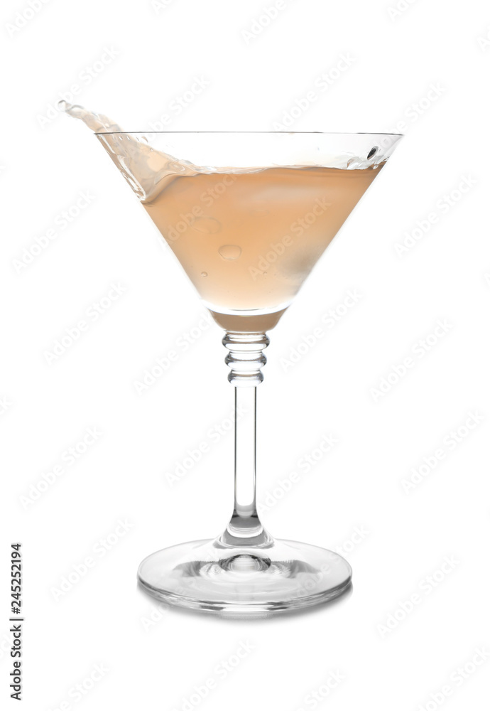 Glass of martini cocktail with splash on white background