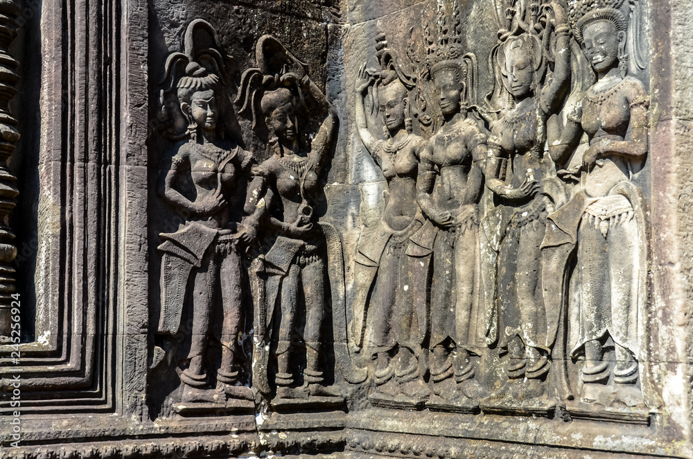 Dancing apsara woman ancient wall carving in Angkor Wat Dancing apsara woman ancient wall carving in Angkor Wat