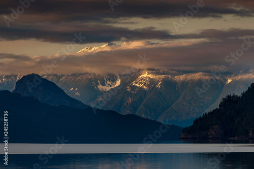 Harrison Lake is the largest lake in the southern Coast Mountains of Canada. The view from the lakefront is dominated by Breckenridge Glacier in the distance and by Echo Island. Lake Harrison, British