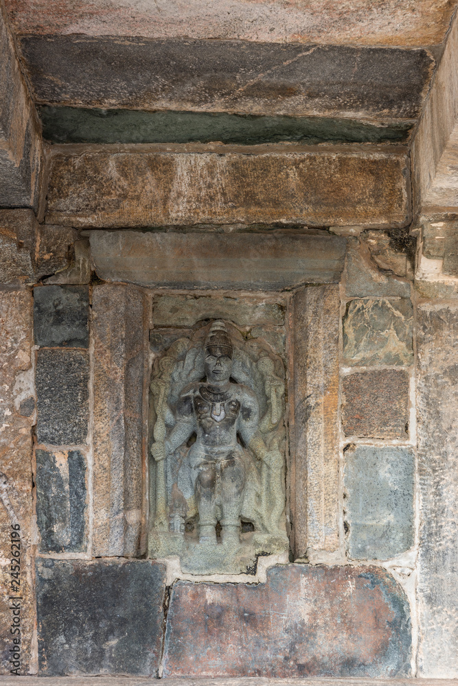 Belur, Karnataka, India - November 2, 2013: Chennakeshava Temple building. Stone statue of Lord Vishnu on wall of temple.