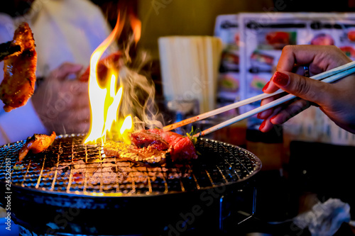 Japanese grilled meat over charcoal on stove