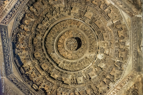 Belur, Karnataka, India - November 2, 2013: Chennakeshava Temple. Brown stone very densely decorated Mandala circles on ceilimg of mandapam in front of Andal shrine. photo