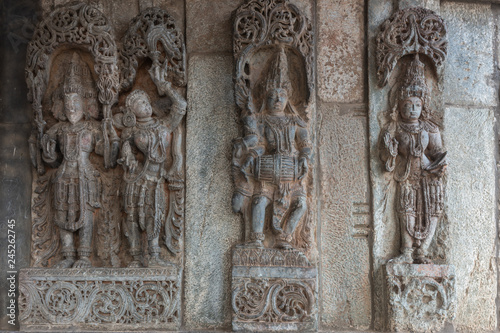 Belur, Karnataka, India - November 2, 2013: Chennakeshava Temple. Statues on wall of nobility, builders and sponsors of the construction of the temple.