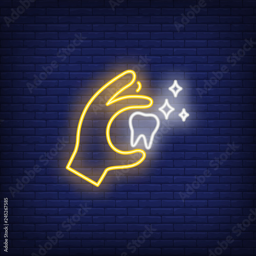Tooth in hand neon sign. Luminous signboard with molar tooth. Night bright advertisement. Vector illustration in neon style for dentistry, clinic, healthcare