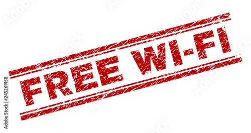 FREE WI-FI seal watermark with distress texture. Red vector rubber print of FREE WI-FI tag with corroded texture. Text tag is placed between double parallel lines.