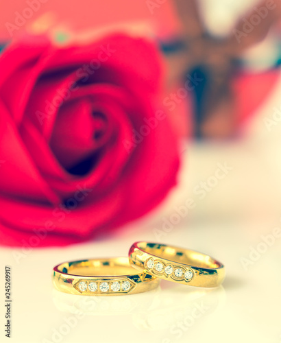 Red roses and gold rings