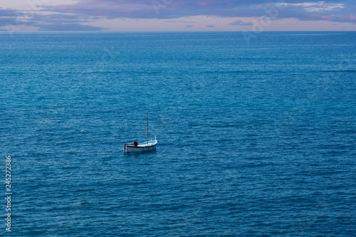 Fisherman in Small Boat in Ocean © saje