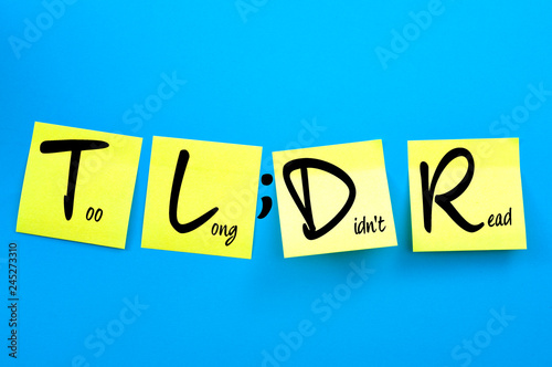 Acronym words and business jargon concept theme with the text or TL;DR written on yellow post it notes on blue background. TLDR means Too Long Didn't Read in office lingo