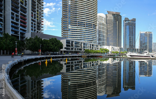 Skyscrapers reflect into the Yarra River in downtown Melbourne, Australia. photo