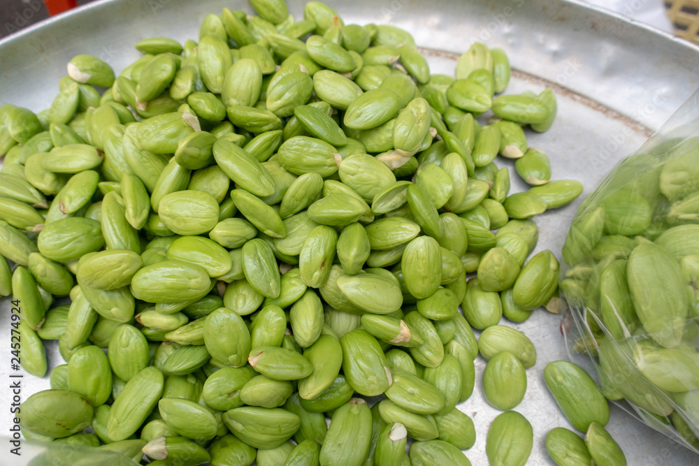 Bitter bean for sale in Market.Parkia speciosa, Zeliang Naga calls it Kampi is a plant of the genus Parkia in the family Fabaceae. It bears long, flat edible beans with bright green seeds the size Bitter bean for sale in Market.Parkia speciosa, Zeliang Naga calls it Kampi is a plant of the genus Parkia in the family Fabaceae. It bears long, flat edible beans with bright green seeds the size