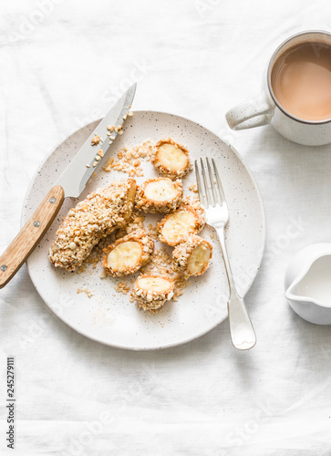 Healthy protein snack, breakfast - peanut butter, seeds, banana nut bites on a light background, top view