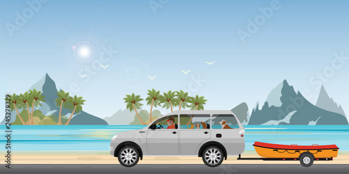 Boat towing car on road running along the sea coast.