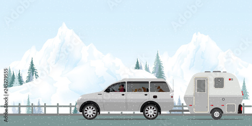 Happy couple driving car on road in winter.1