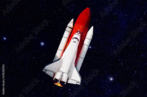 Fototapeta Naklejka Na Ścianę i Meble -  Rocket Ship in Space - Elements of this Image Furnished by NASA