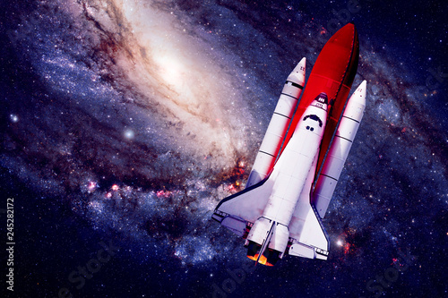 Fototapeta Naklejka Na Ścianę i Meble -  Rocket Ship in Space - Elements of this Image Furnished by NASA