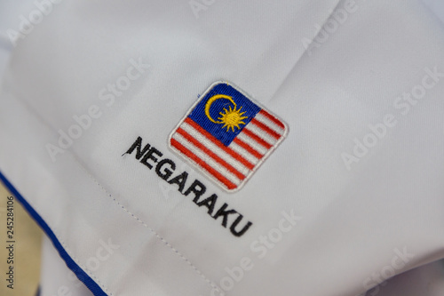 Close-up Of embroidery Malaysia Logo with Wording NEGARAKU (My Country) on white uniform photo