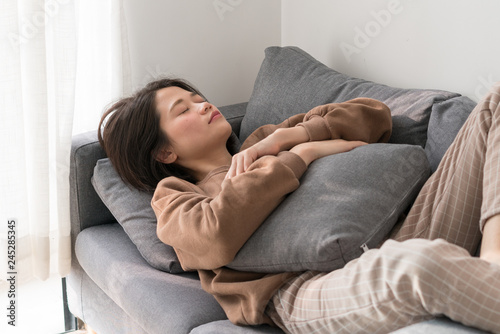 asian female sleeping on sofa