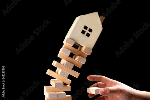 house falling down from a unstable base concept of real estate invesetment Fototapeta