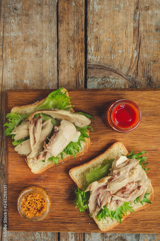 sandwich with chicken and lettuce. food background. copy space sandwich with chicken and lettuce. food background. copy space