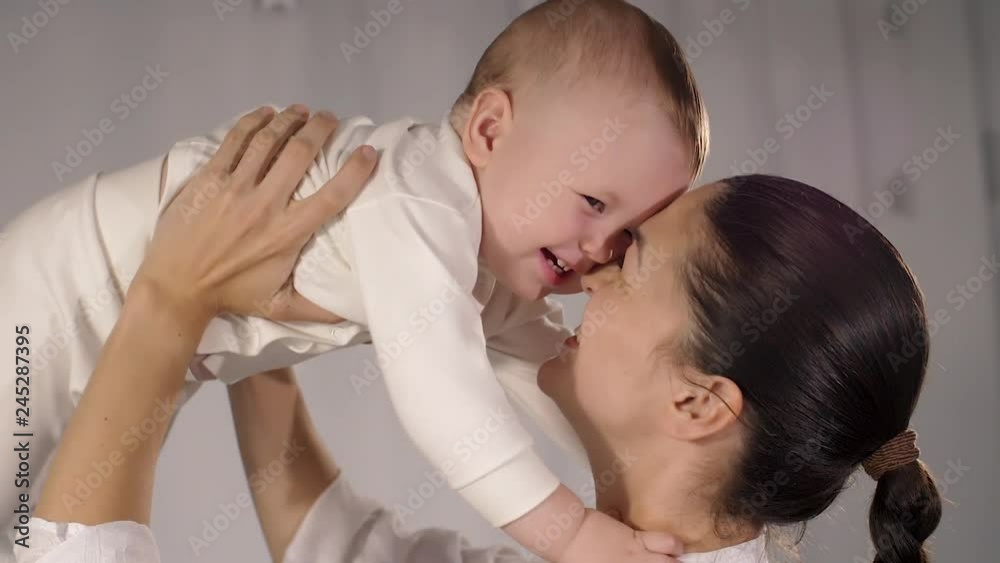 Mother hold her baby and smiling Mother hold her baby and smiling