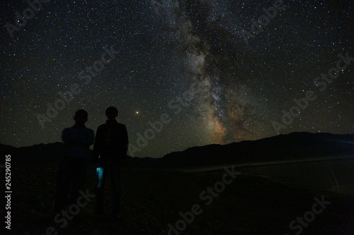 night sky with people and mountains